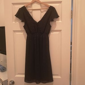 Unworn, dark blue dress with gold dots